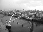 Millenium bridge raised in black and white but it started raining so there is rain drops on the glass