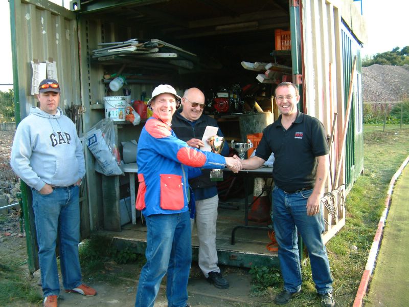 Phil Studley (!?) taking a trophy for some reason